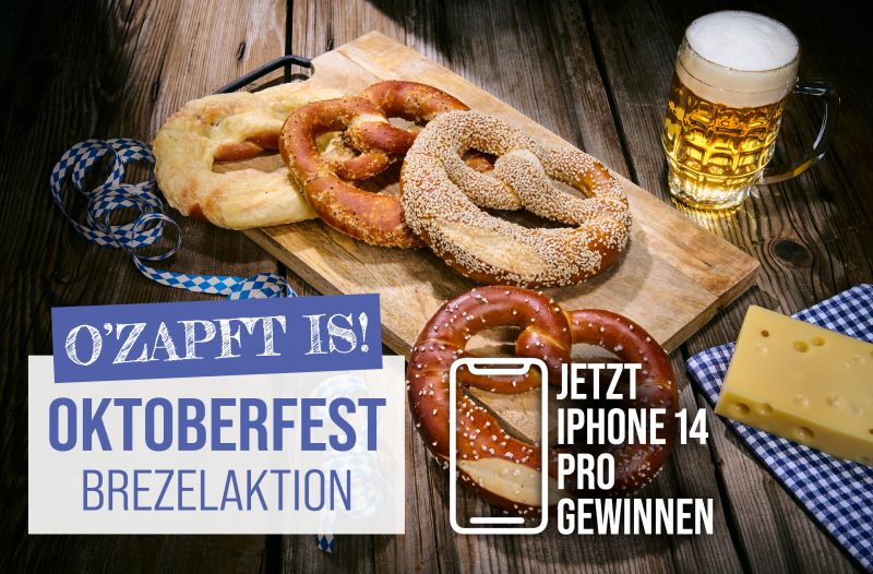 Oktoberfest-Brezelaktion mit Gewinnspiel – Schäfer Dein Bäcker Oktoberfestbrezeln mit Bier, Käse und iPhone-Gewinnspiel-Aktion auf Holzbrett.